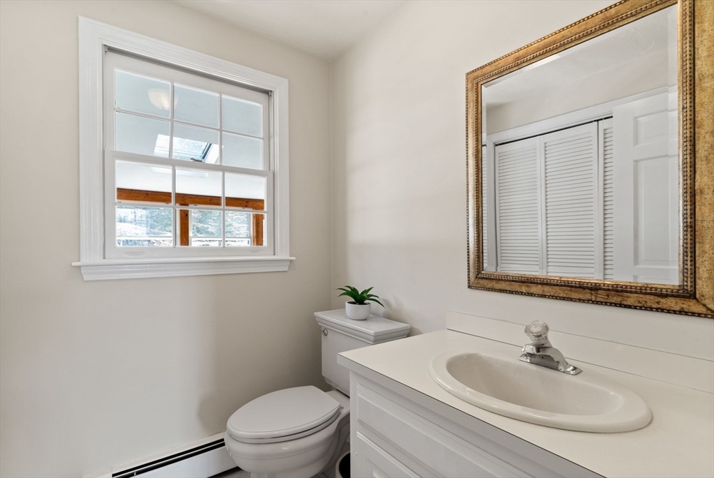 21 Worcester Road Norfolk, MA 02056 - Photo 20 of 40 a bathroom with a sink a toilet and a mirror