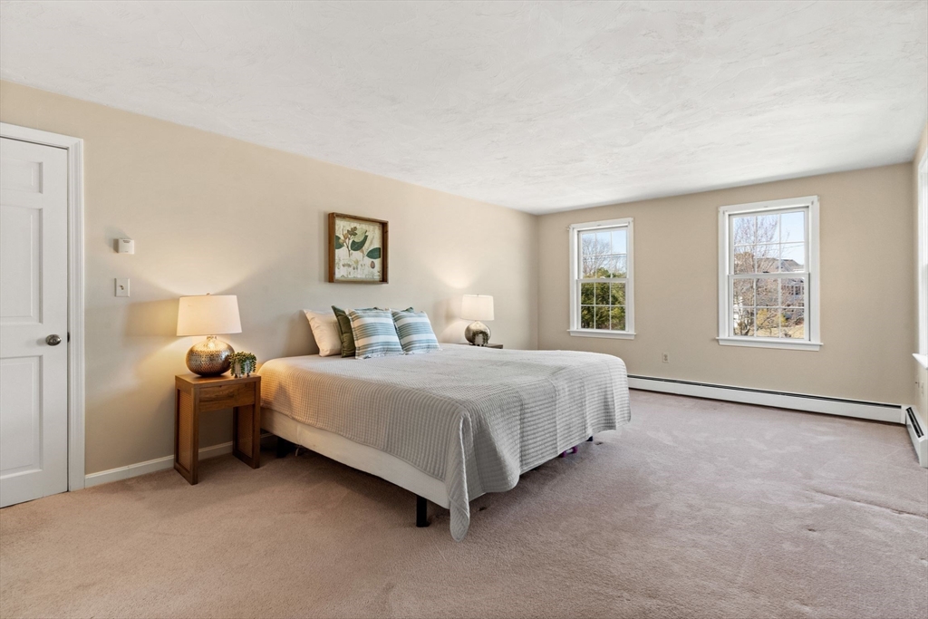 21 Worcester Road Norfolk, MA 02056 - Photo 22 of 40 a spacious bedroom with a bed and a window