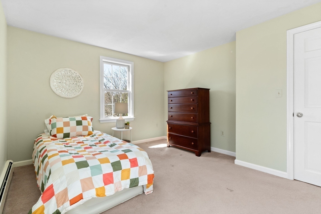 21 Worcester Road Norfolk, MA 02056 - Photo 26 of 40 a bedroom with a bed and a closet