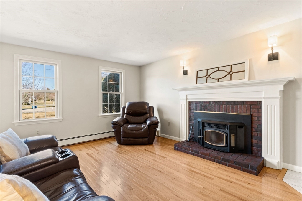 21 Worcester Road Norfolk, MA 02056 - Photo 6 of 40 a living room with furniture and a fireplace