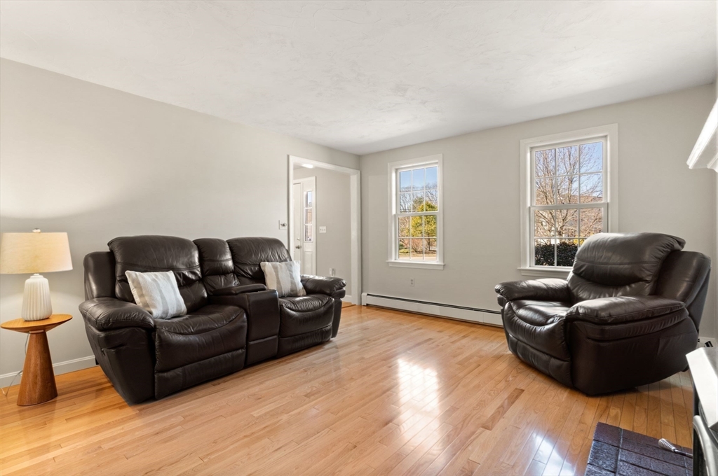 21 Worcester Road Norfolk, MA 02056 - Photo 7 of 40 a living room with furniture and a wooden floor