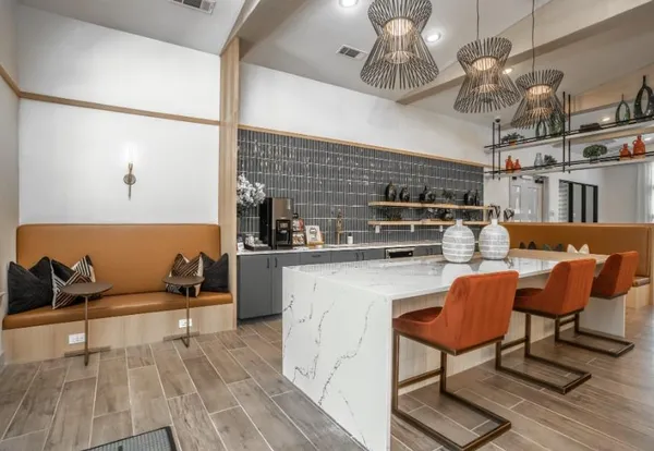 a kitchen with stainless steel appliances granite countertop a sink and a refrigerator