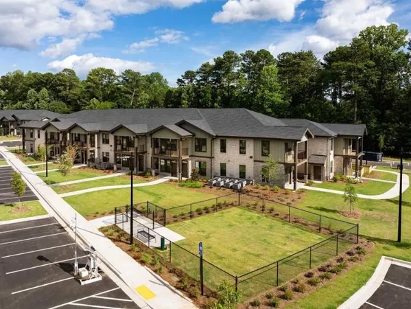 a view of residential houses with swimming pool