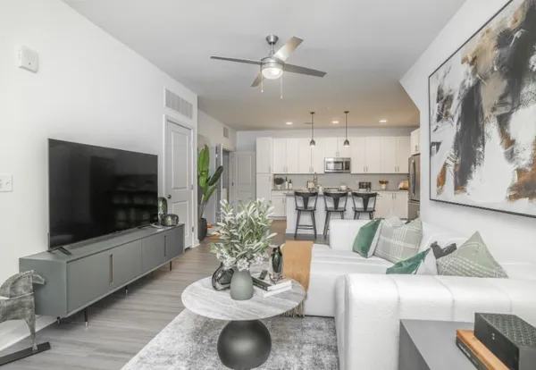 a living room with furniture and a flat screen tv