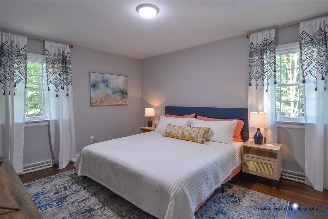 5180 Bemiss Road Richmond, VA 23234 - Photo 15 of 31 a bedroom with a bed wooden floor and window