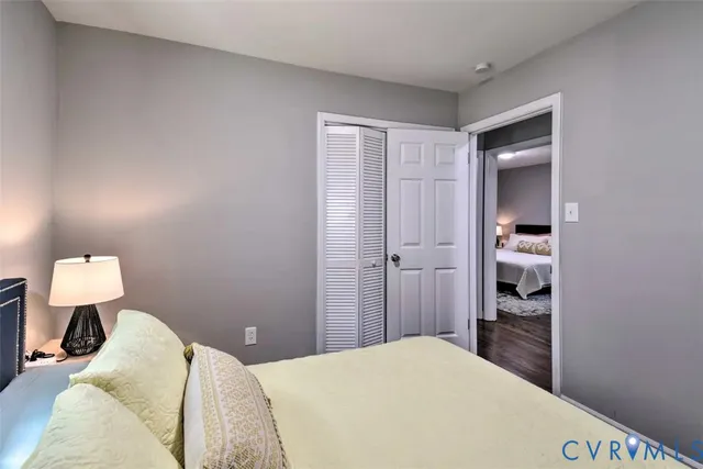 a bedroom with a bed and bathroom