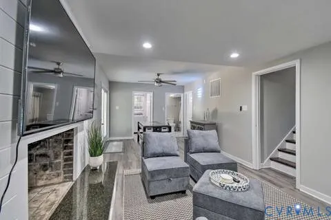 a living room with furniture and a flat screen tv