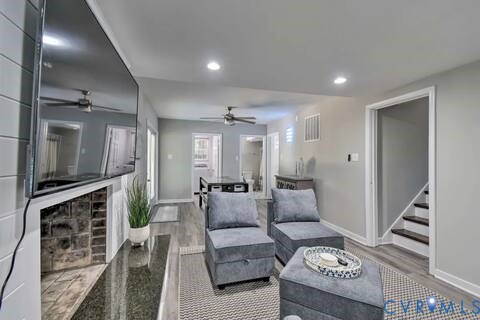 5180 Bemiss Road Richmond, VA 23234 - Photo 21 of 31 a living room with furniture and a flat screen tv