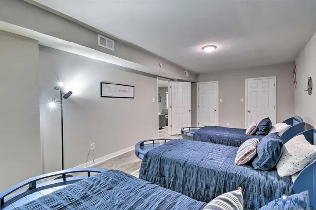 a bathroom with a sink vanity mirror and toilet