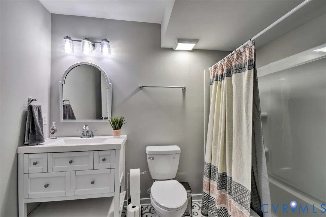 5180 Bemiss Road Richmond, VA 23234 - Photo 26 of 31 a bathroom with a sink vanity mirror and toilet