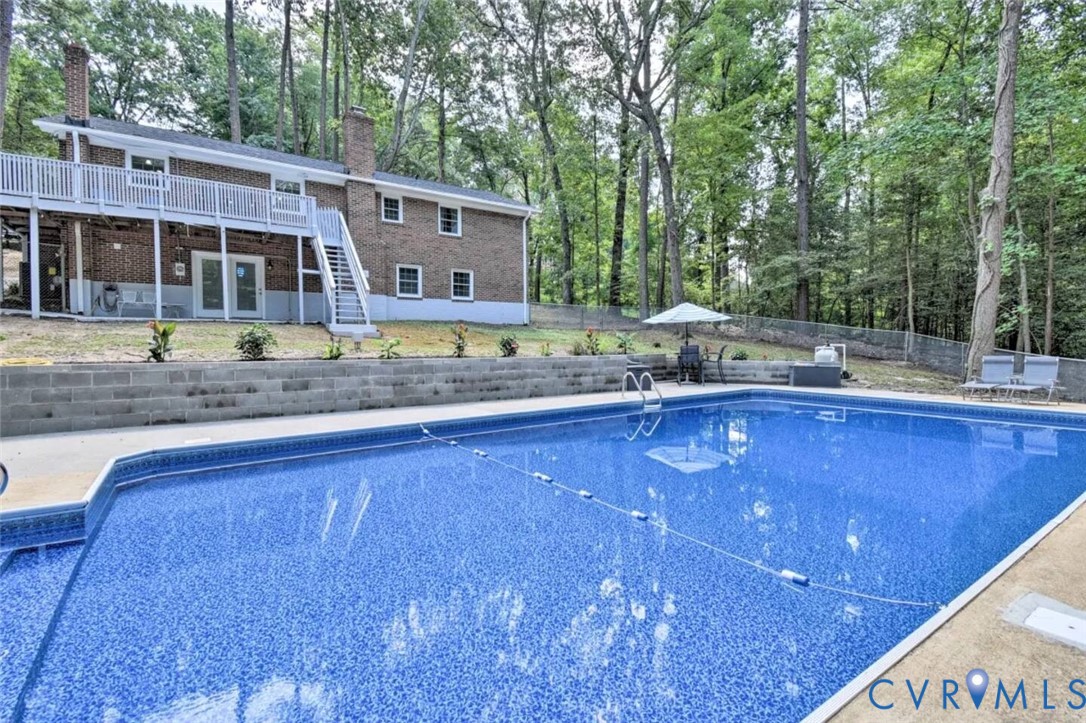 5180 Bemiss Road Richmond, VA 23234 - Photo 29 of 31 a view of a house with a swimming pool