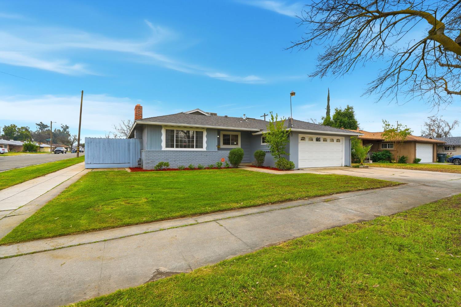 2826 East Hampton Way Fresno, CA 93726 - Photo 3 of 33 a view of house with a yard