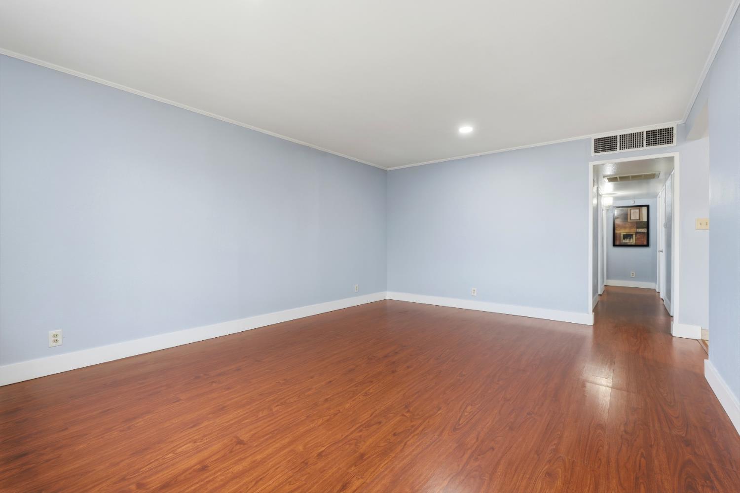 2826 East Hampton Way Fresno, CA 93726 - Photo 7 of 33 a view of an empty room with wooden floor