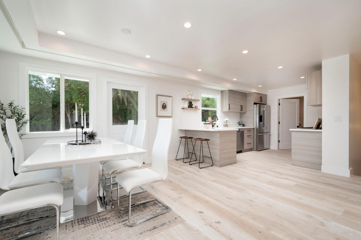 411 Ridge Road San Carlos, CA 94070 - Photo 11 of 40 a living room with furniture and a dining table with kitchen view