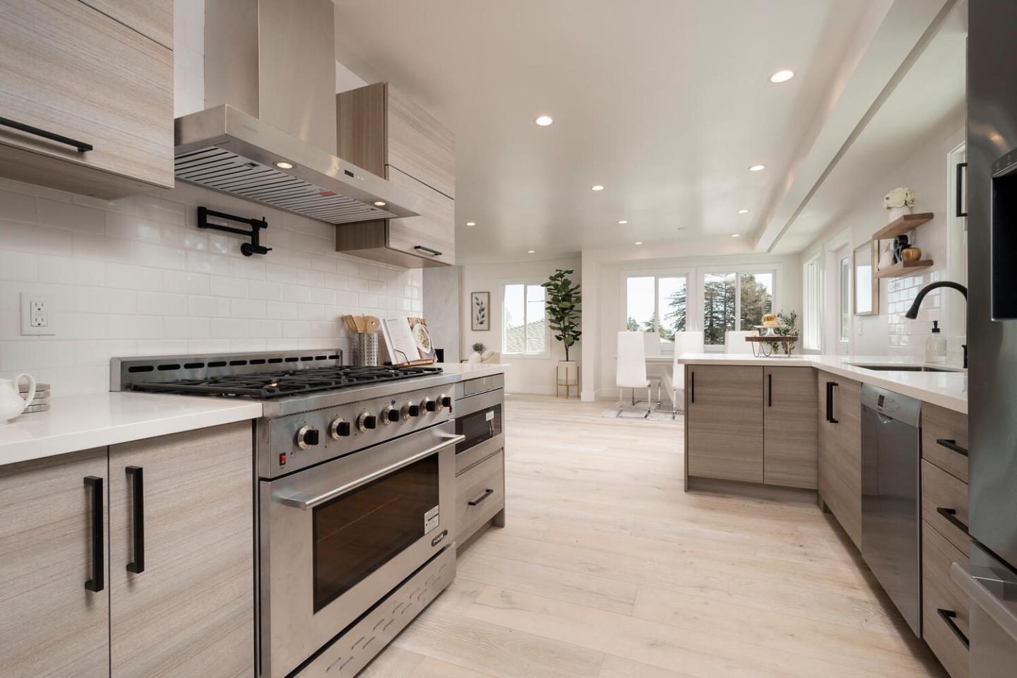 411 Ridge Road San Carlos, CA 94070 - Photo 13 of 40 a kitchen with stainless steel appliances granite countertop a stove and a sink