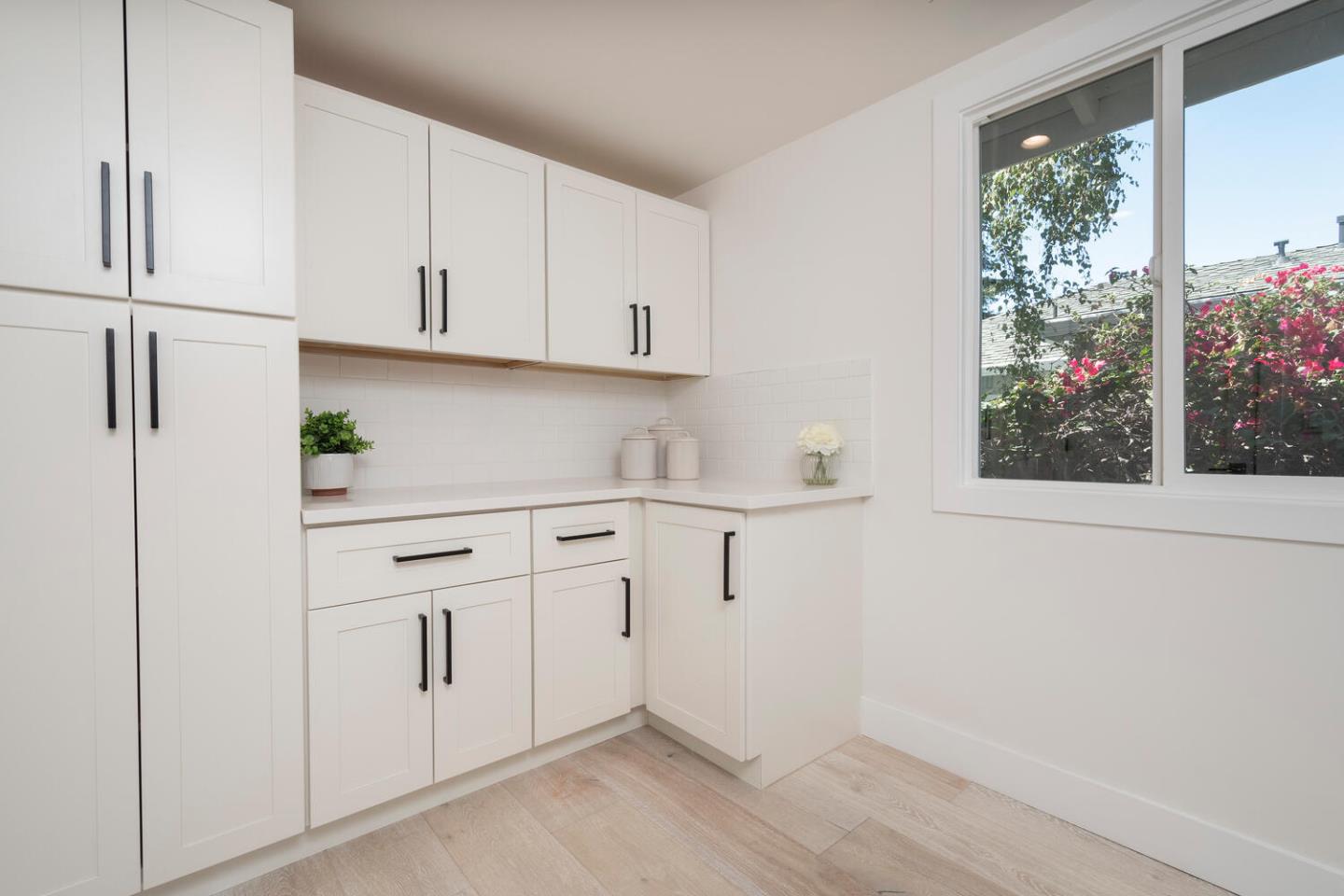 411 Ridge Road San Carlos, CA 94070 - Photo 14 of 40 a view of white cabinets and window