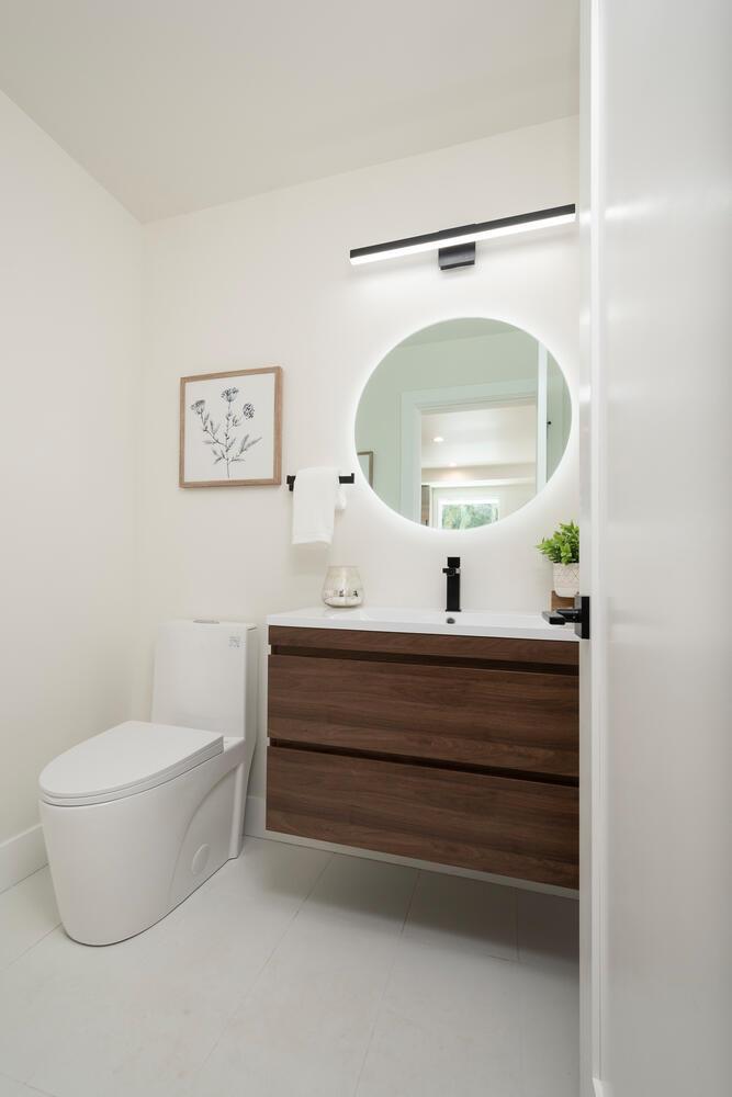411 Ridge Road San Carlos, CA 94070 - Photo 15 of 40 a bathroom with a toilet a sink and a mirror