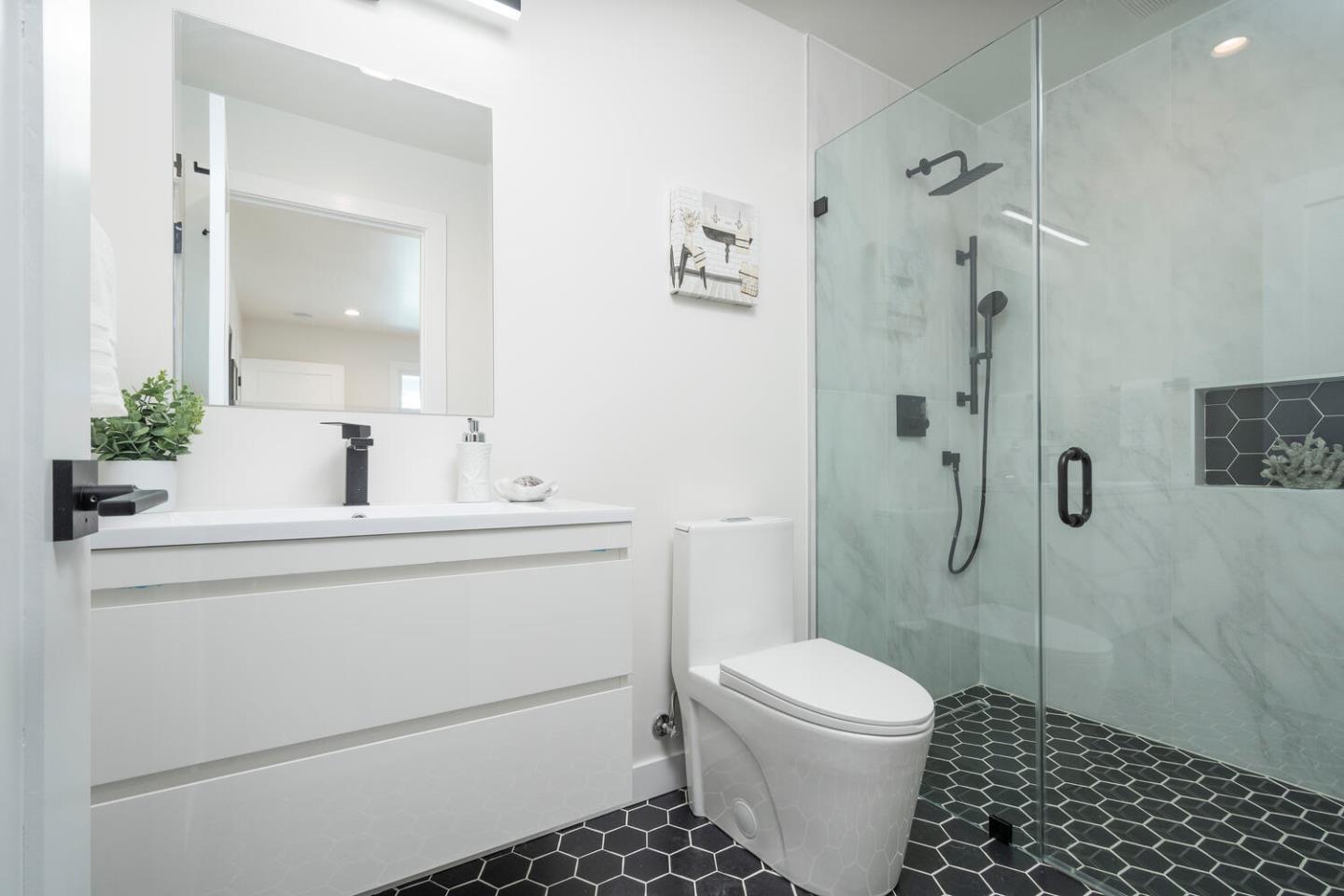 411 Ridge Road San Carlos, CA 94070 - Photo 18 of 40 a bathroom with a sink a toilet a shower and a mirror