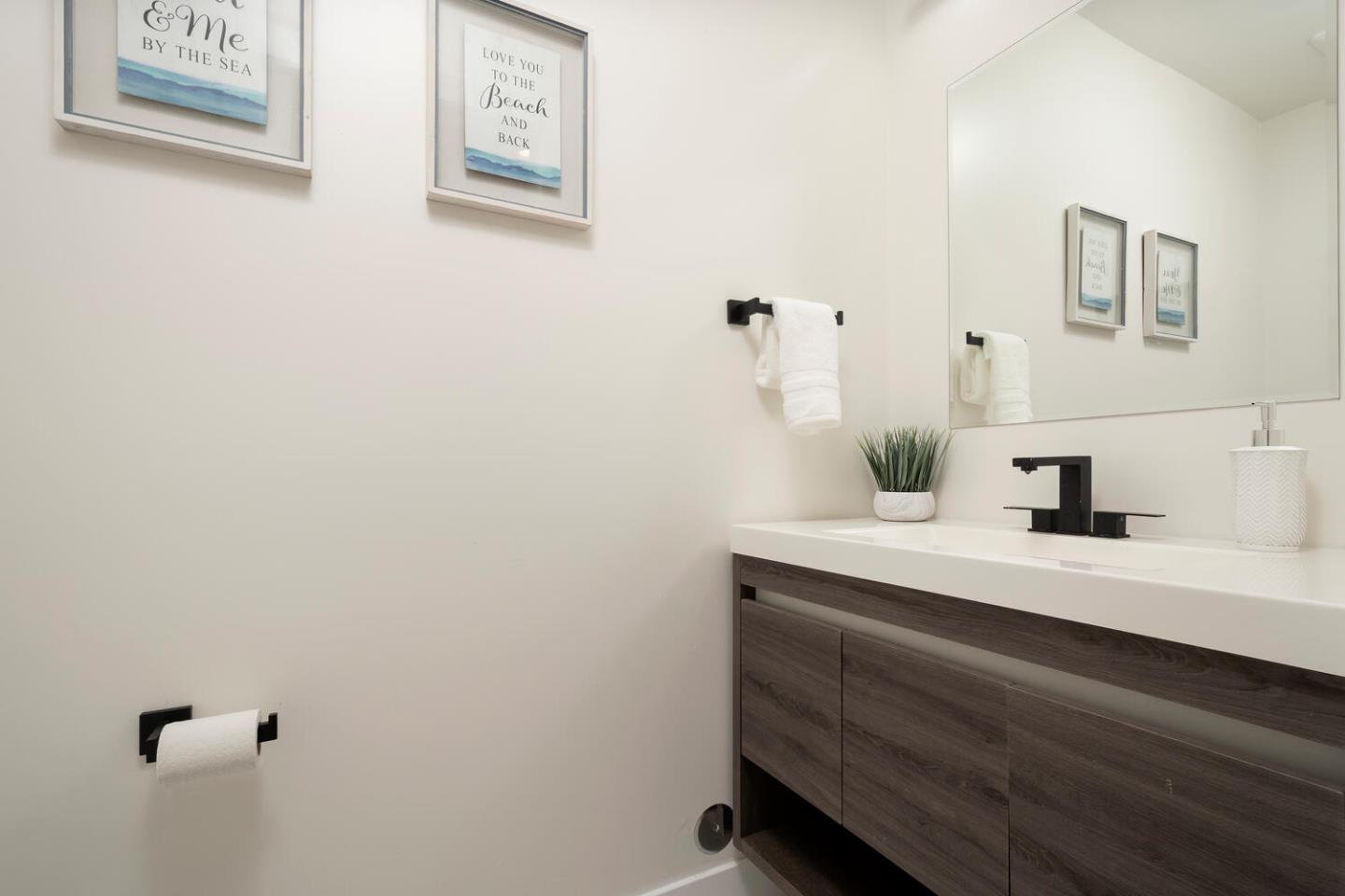 411 Ridge Road San Carlos, CA 94070 - Photo 21 of 40 a view of bathroom with a sink and a mirror