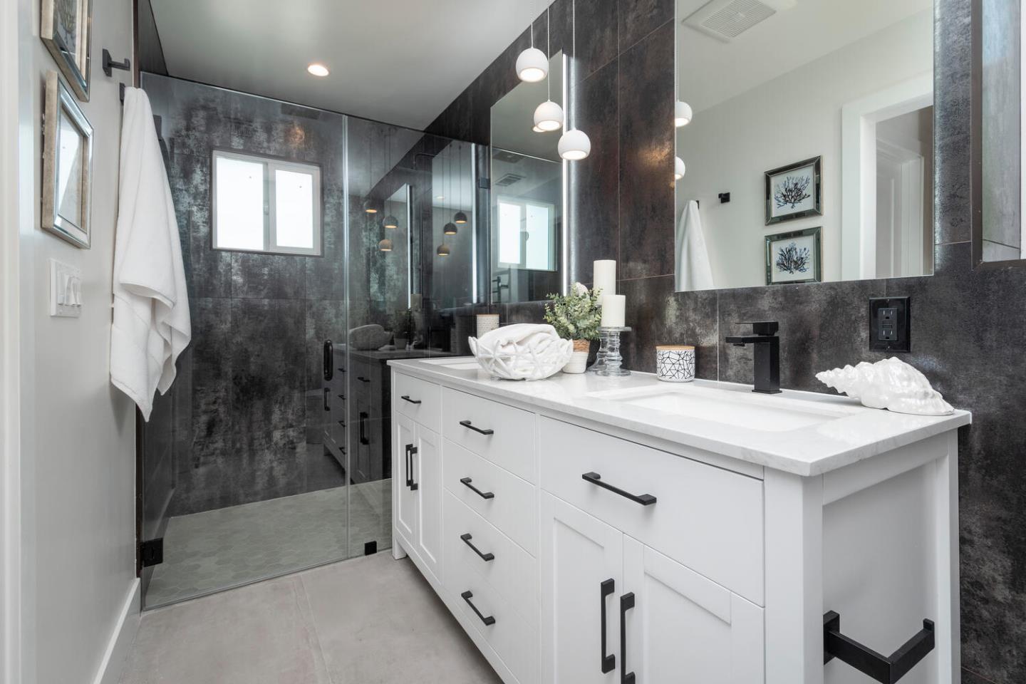 411 Ridge Road San Carlos, CA 94070 - Photo 24 of 40 a bathroom with a sink mirror and a shower