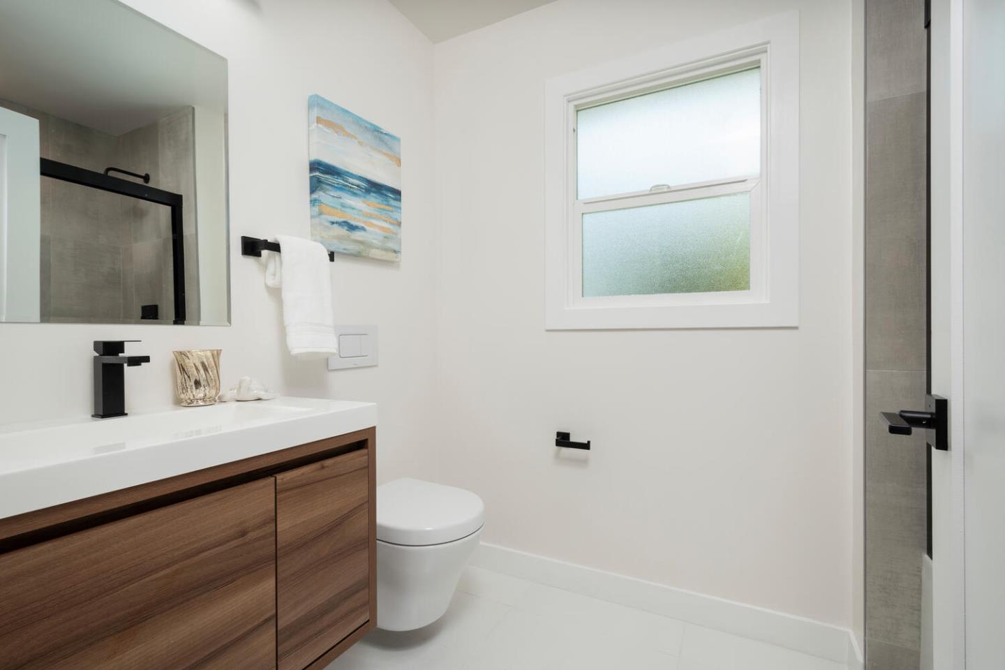 411 Ridge Road San Carlos, CA 94070 - Photo 27 of 40 a bathroom with a granite countertop sink toilet a mirror and shower