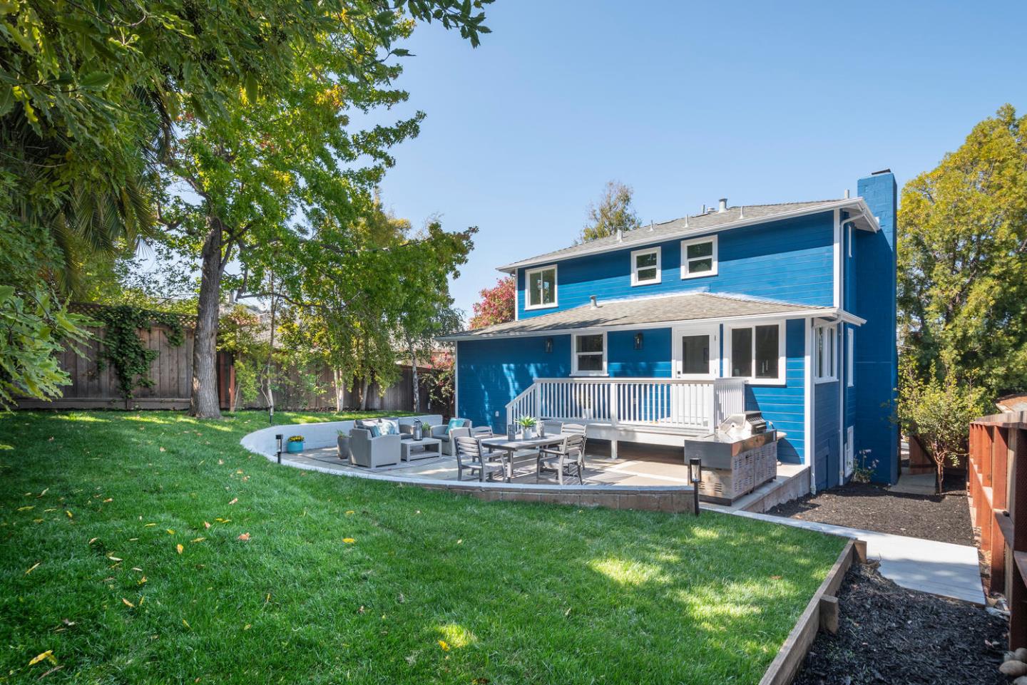 411 Ridge Road San Carlos, CA 94070 - Photo 31 of 40 a front view of a house with garden and sitting area