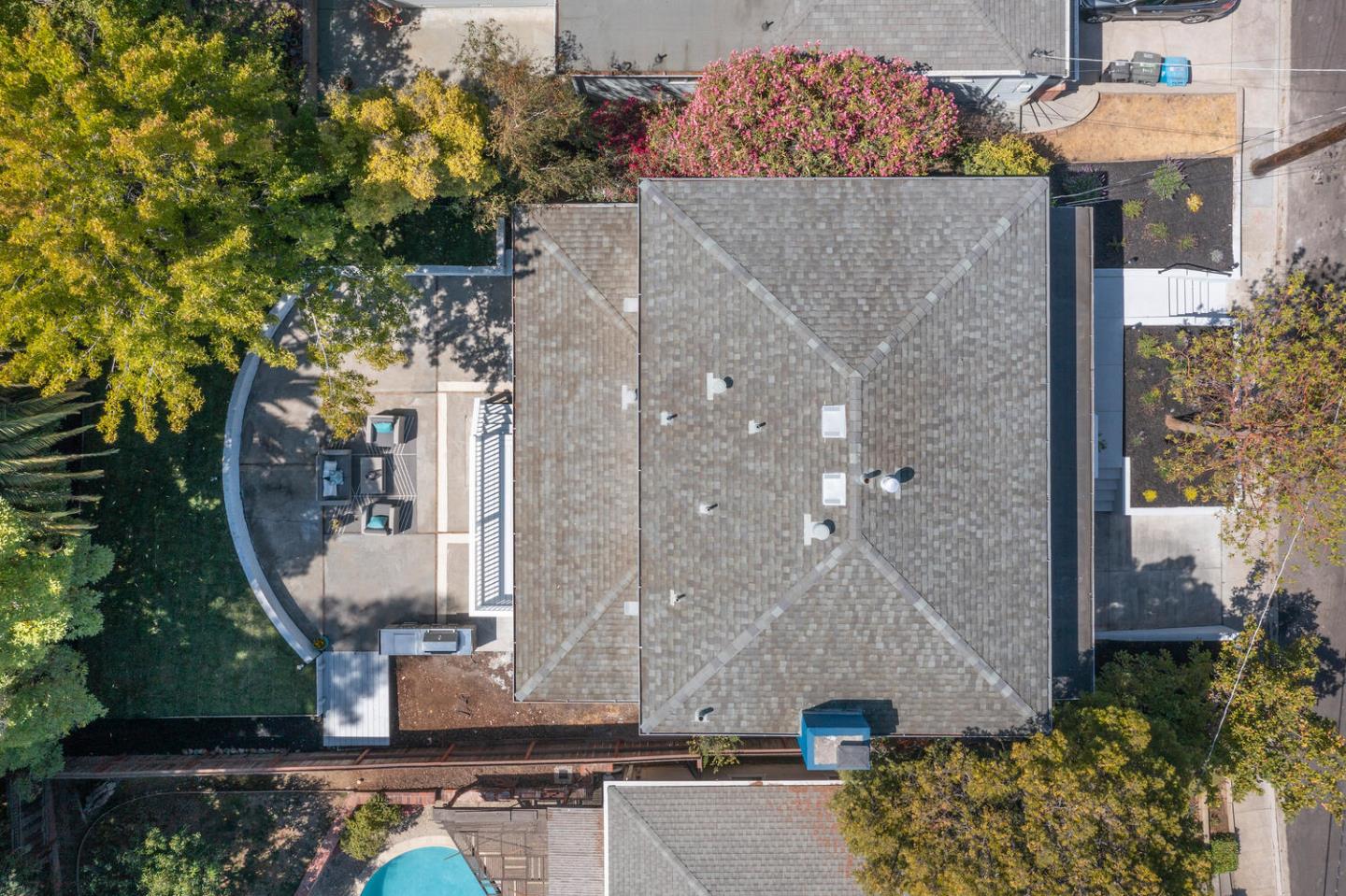 411 Ridge Road San Carlos, CA 94070 - Photo 36 of 40 an aerial view of a house with a swimming pool and large trees