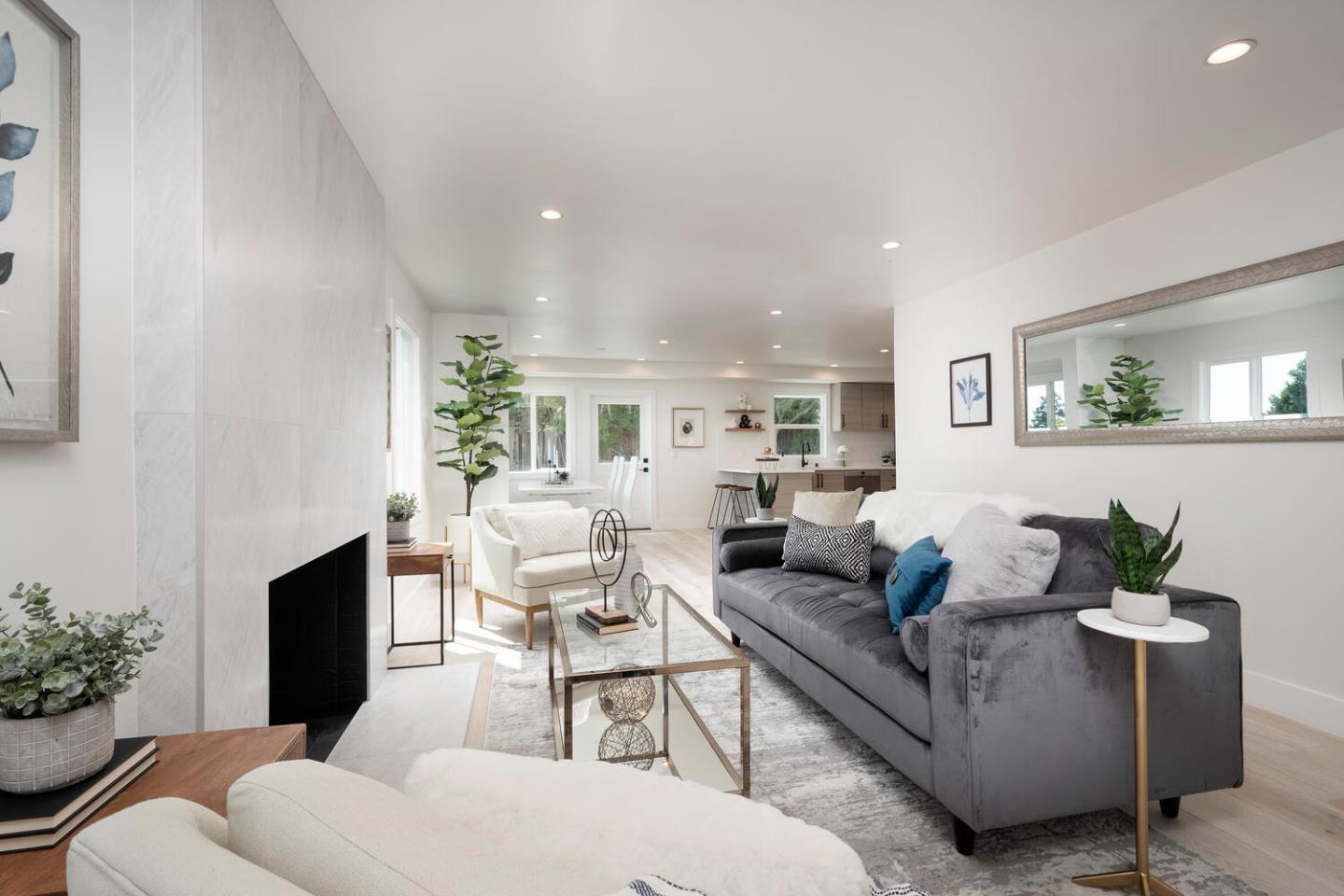 411 Ridge Road San Carlos, CA 94070 - Photo 9 of 40 a living room with furniture potted plant and a fireplace