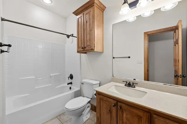 a bathroom with a sink a toilet and a bathtub