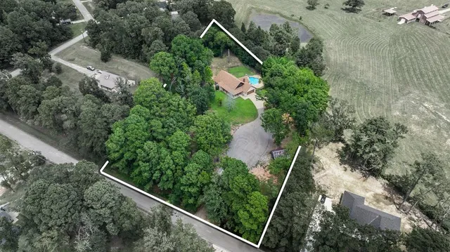 an aerial view of house with yard