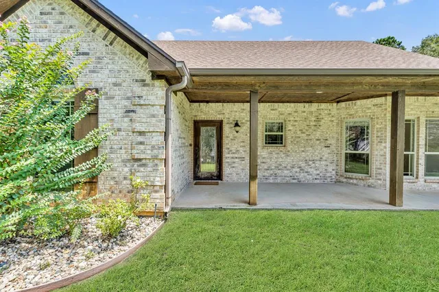 a view of a porch with a backyard