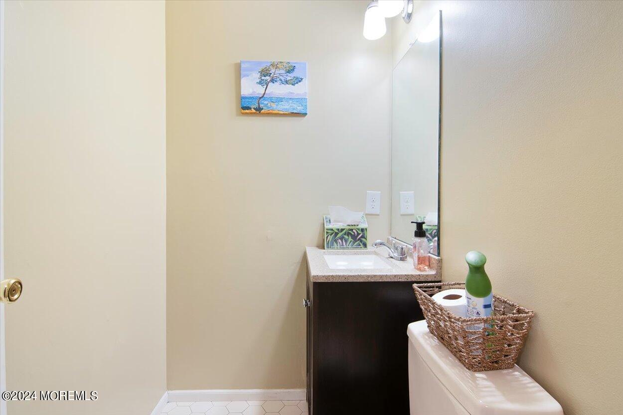53 Racquet Road Wall, NJ 07719 - Photo 14 of 29 a bathroom with a sink toilet and a mirror
