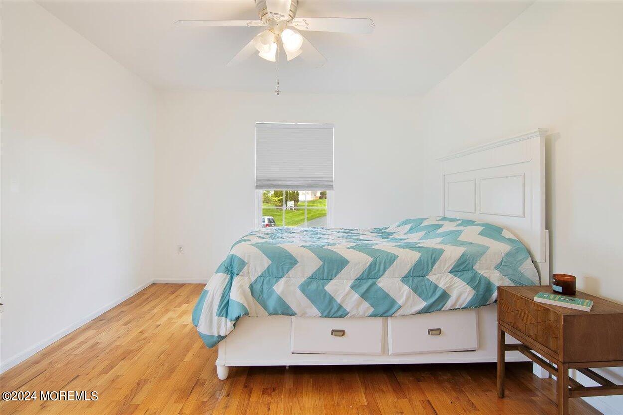 53 Racquet Road Wall, NJ 07719 - Photo 17 of 29 a bedroom with a bed and window