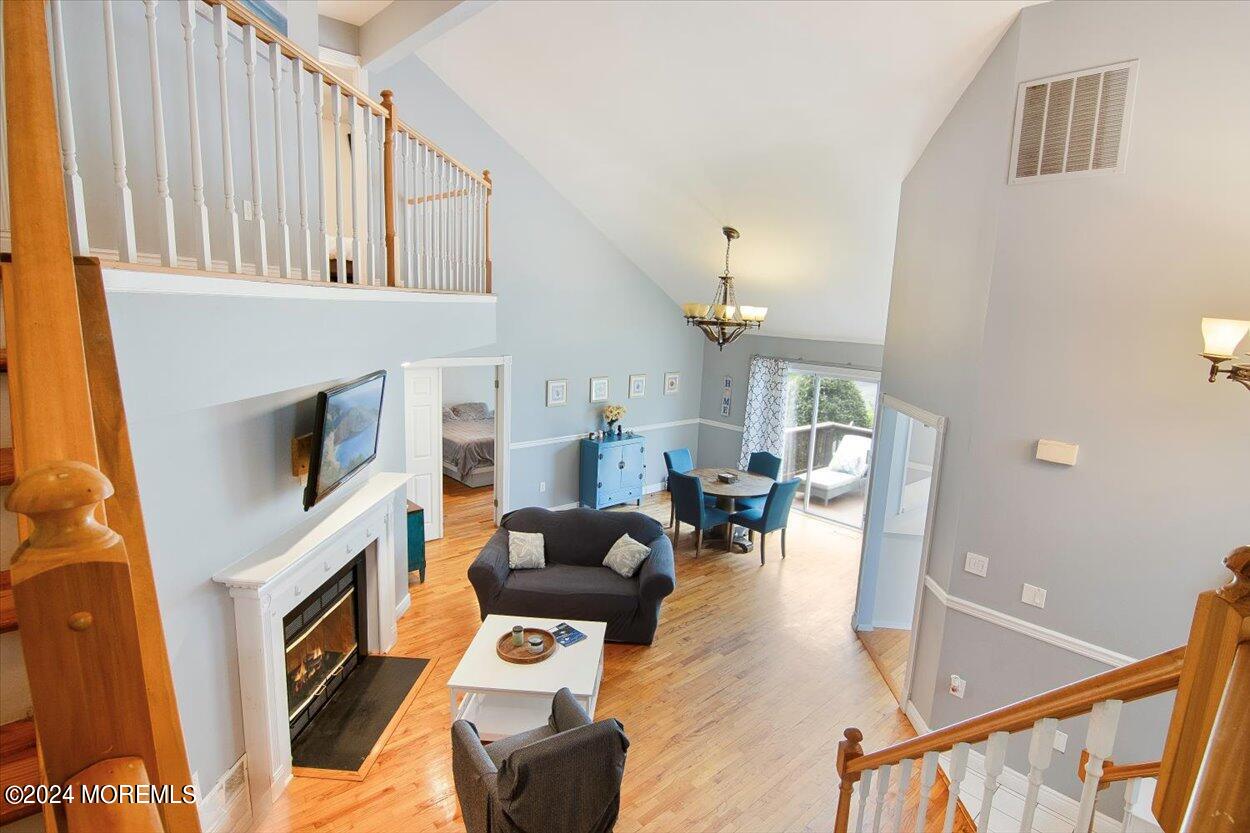53 Racquet Road Wall, NJ 07719 - Photo 19 of 29 a living room with fireplace furniture and a flat screen tv