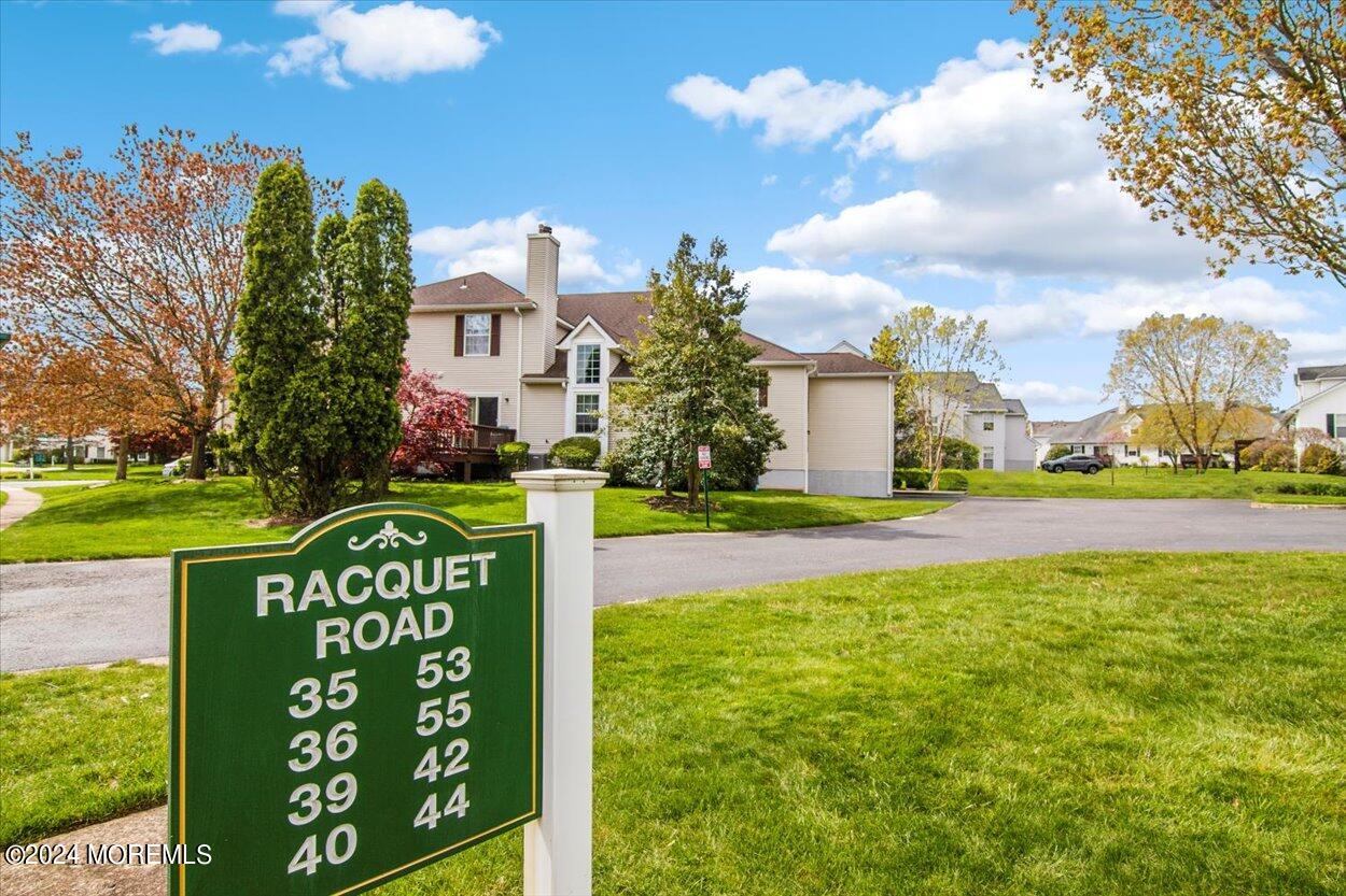 53 Racquet Road Wall, NJ 07719 - Photo 25 of 29 a front view of a house with garden