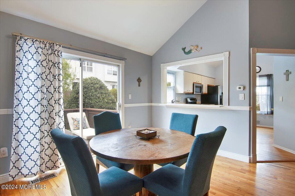53 Racquet Road Wall, NJ 07719 - Photo 5 of 29 a view of a dining room with furniture window and wooden floor