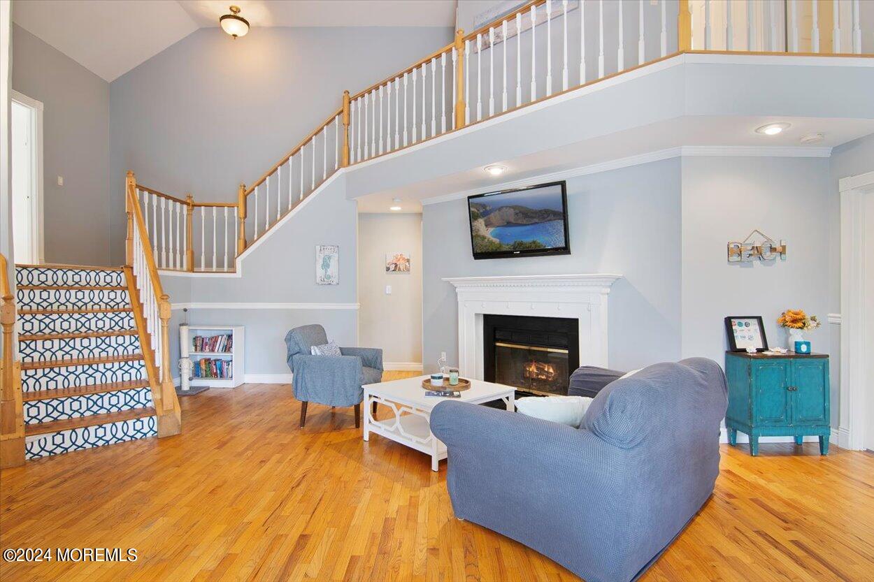 53 Racquet Road Wall, NJ 07719 - Photo 6 of 29 a living room with furniture and a fireplace