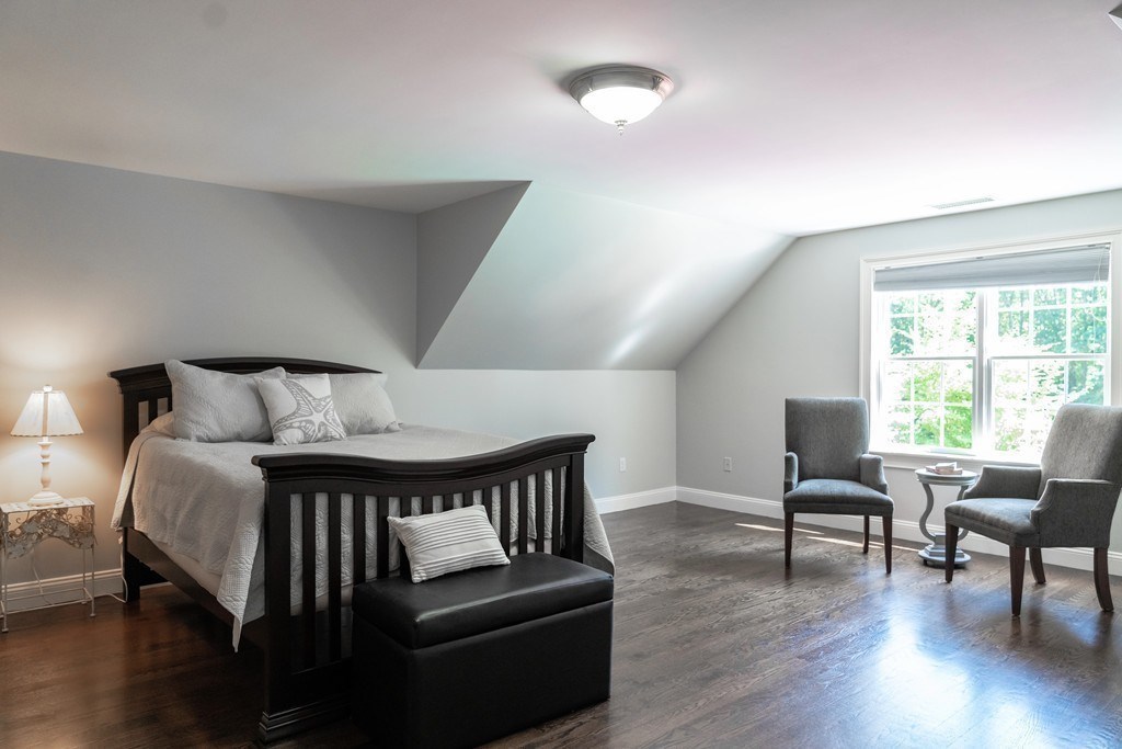 16 B Laurel Hollow Road Boxford, MA 01921 - Photo 21 of 39 a bedroom with a bed and wooden floor