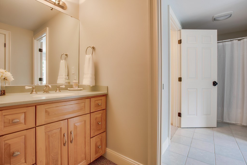 16 B Laurel Hollow Road Boxford, MA 01921 - Photo 25 of 39 a bathroom with a double vanity sink and a mirror