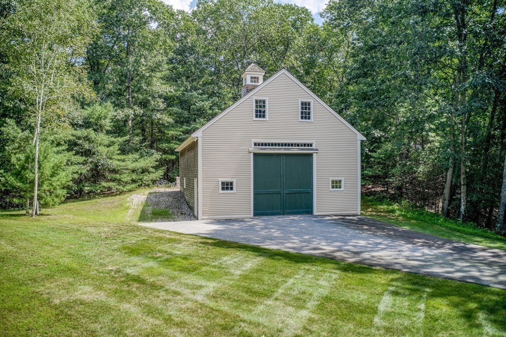 16 B Laurel Hollow Road Boxford, MA 01921 - Photo 38 of 39 a view of a small house with a yard