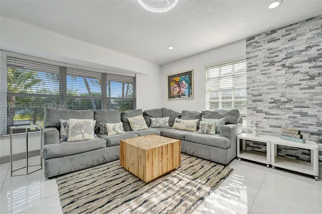 a kitchen with stainless steel appliances a refrigerator sink and cabinets
