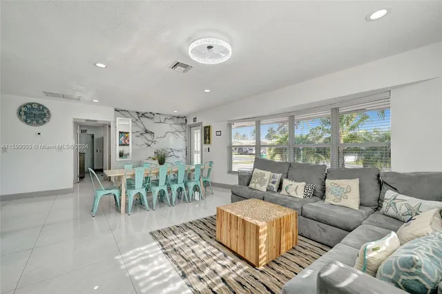 a kitchen with stainless steel appliances granite countertop a sink stove top oven and cabinets