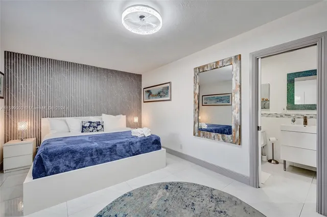 a bathroom with a toilet a sink and a shower