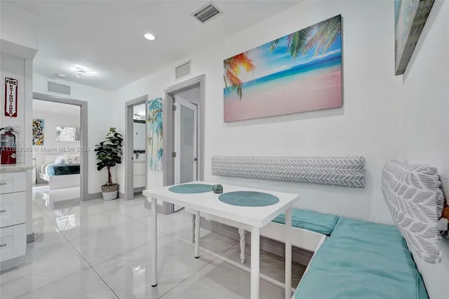 a view of a storage and utility room with washer and dryer