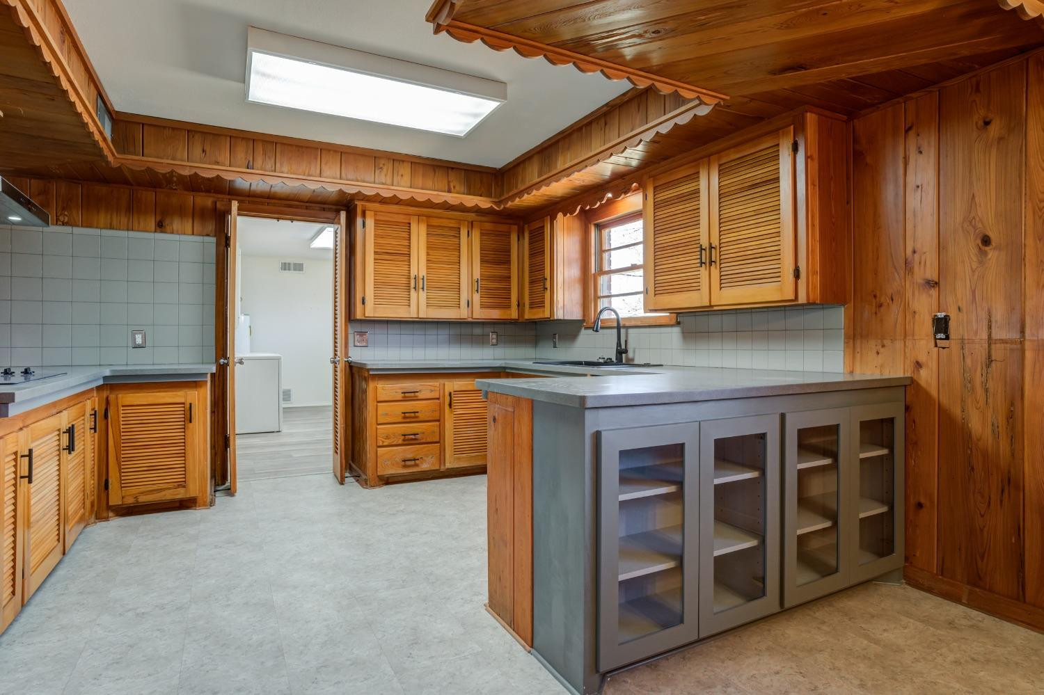 3410 40th Street Lubbock, TX 79413 - Photo 12 of 45 a view of a kitchen with cabinets