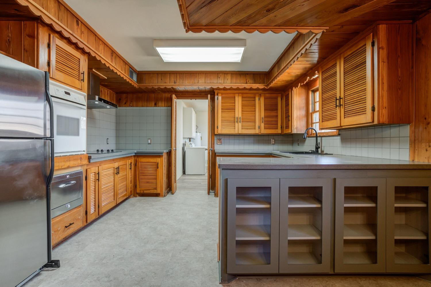 3410 40th Street Lubbock, TX 79413 - Photo 19 of 45 a kitchen with stainless steel appliances granite countertop a stove a sink and a microwave