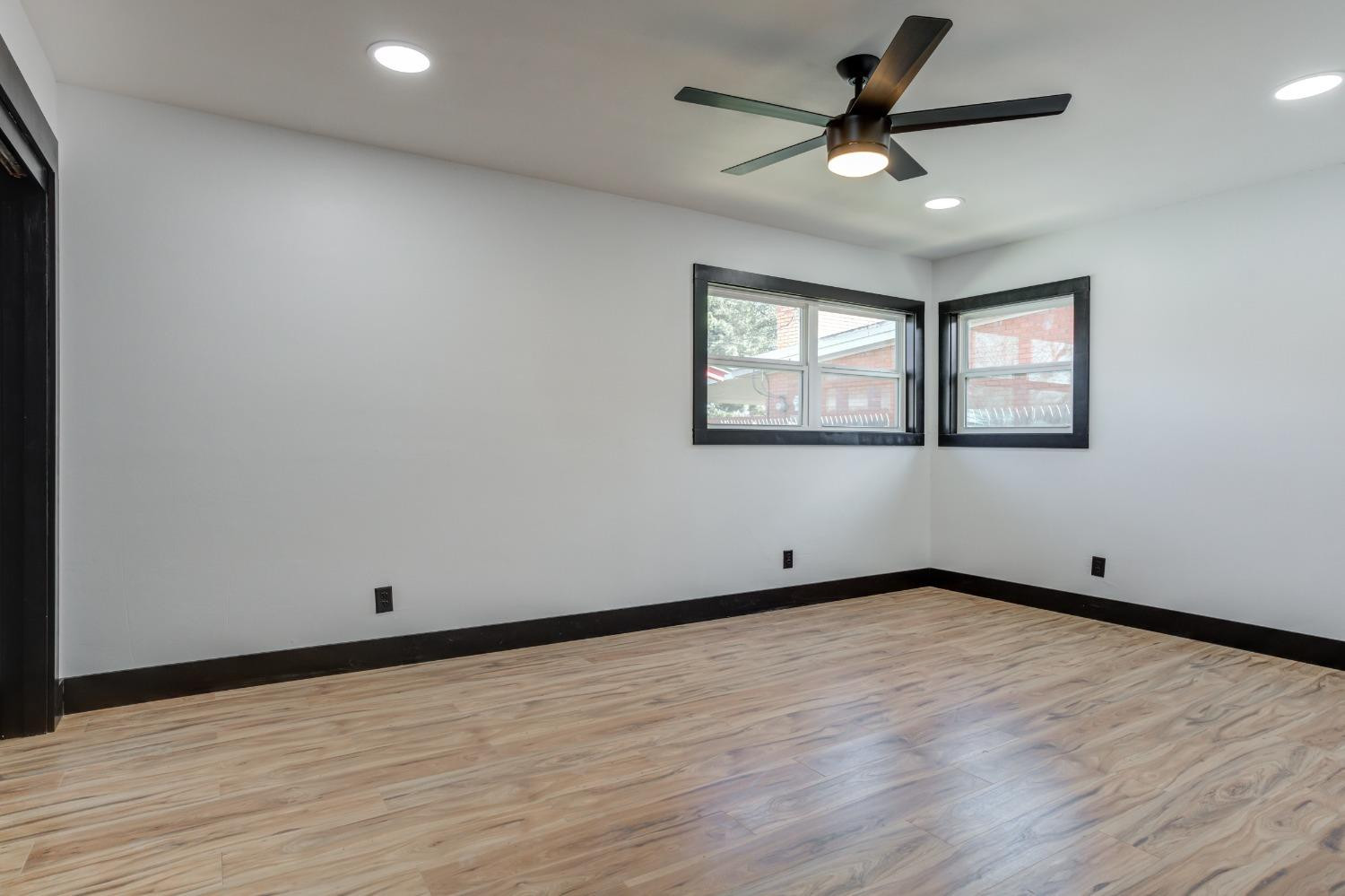 3410 40th Street Lubbock, TX 79413 - Photo 26 of 45 wooden floor in an empty room with a window