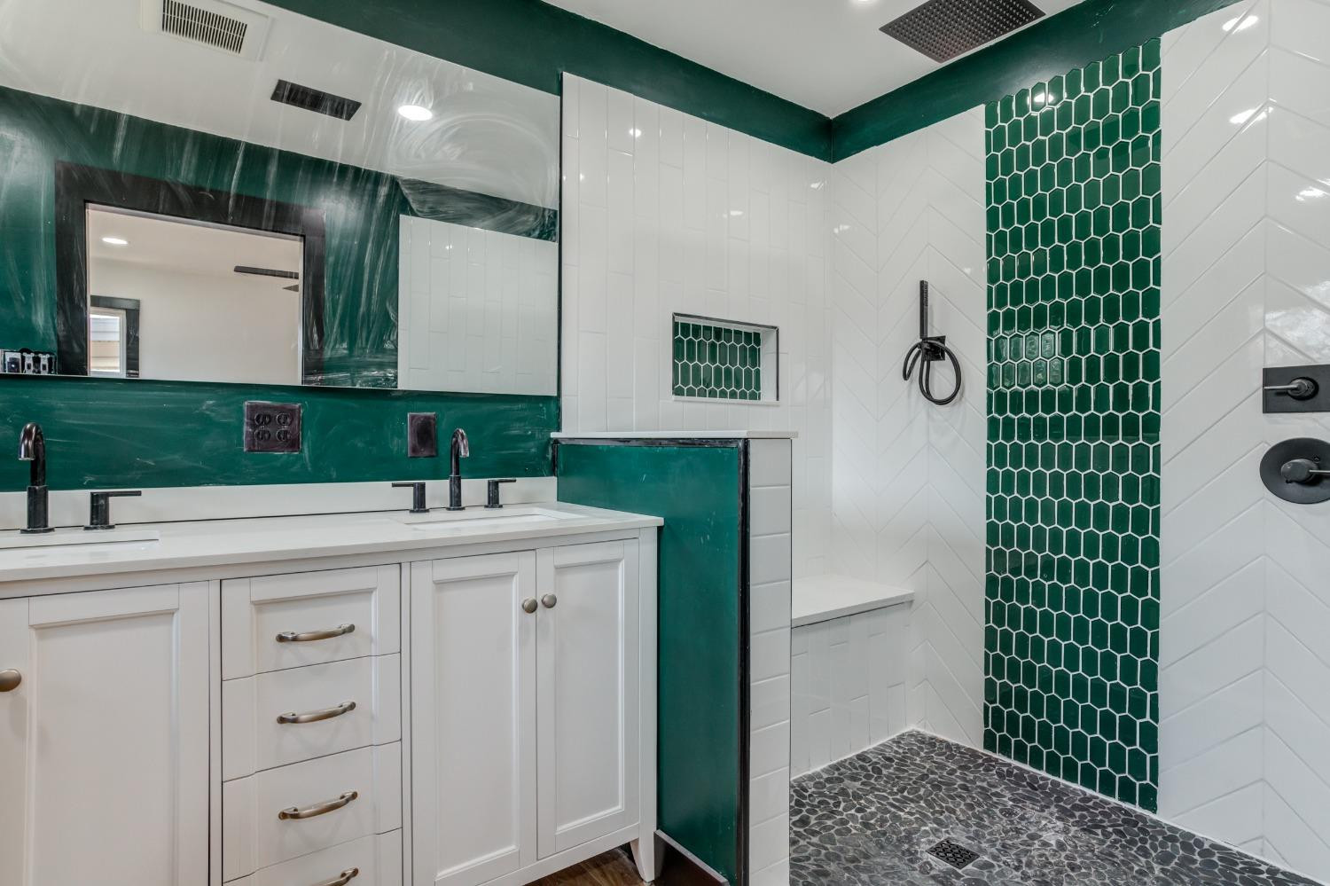 3410 40th Street Lubbock, TX 79413 - Photo 31 of 45 a bathroom with a sink and a mirror
