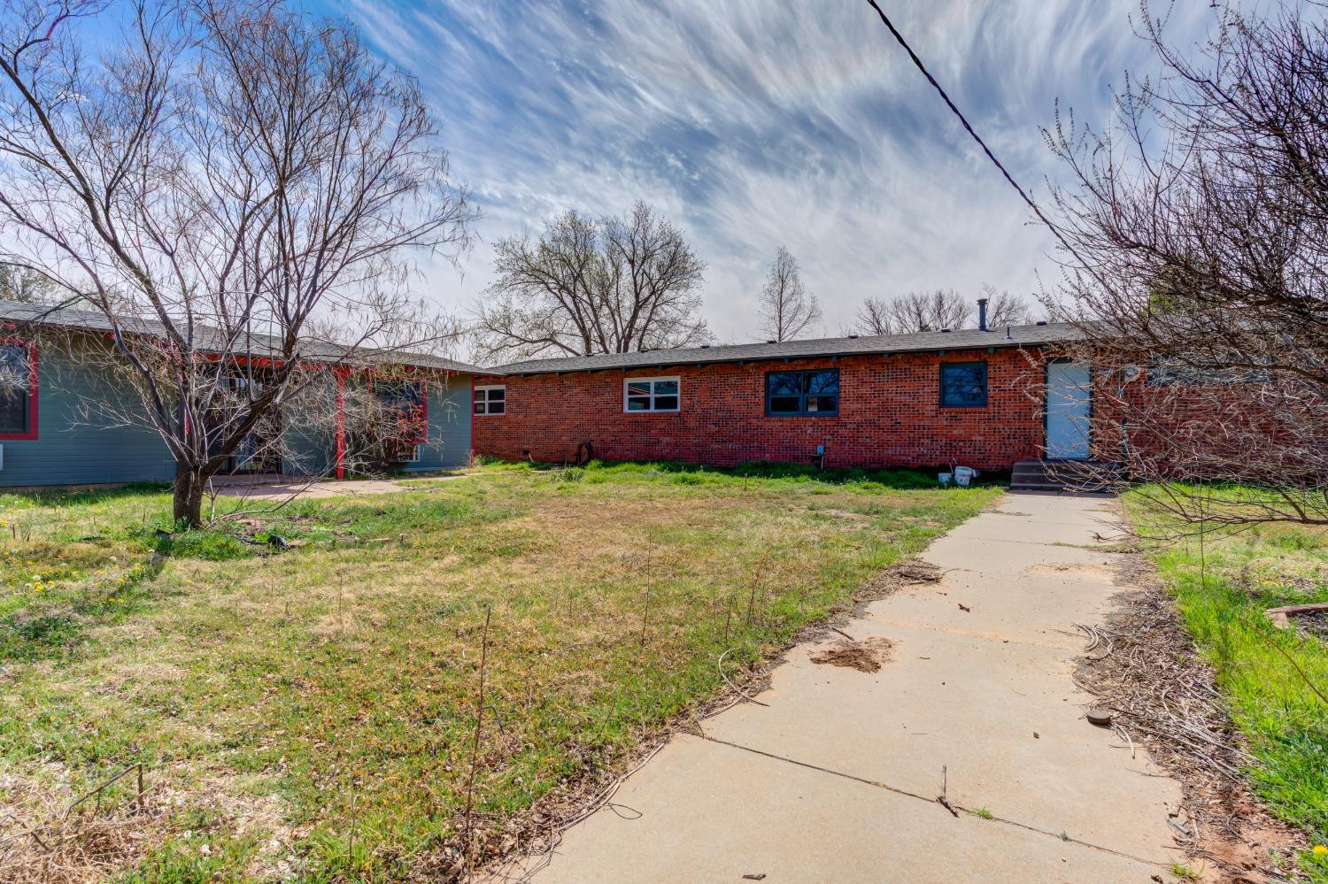 3410 40th Street Lubbock, TX 79413 - Photo 34 of 45 a view of front of house with yard and green space