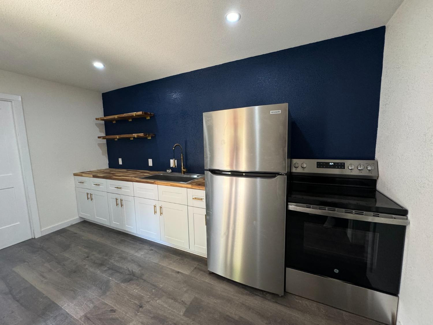3410 40th Street Lubbock, TX 79413 - Photo 39 of 45 a kitchen with cabinets and stainless steel appliances